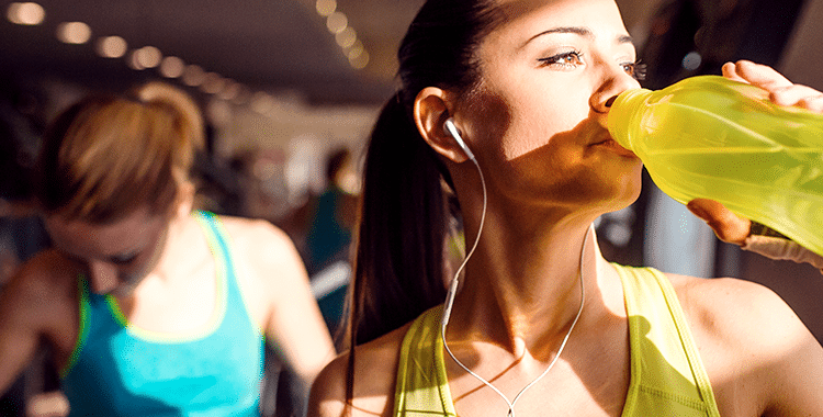 Woman Hydrating After Sweating at the Gym