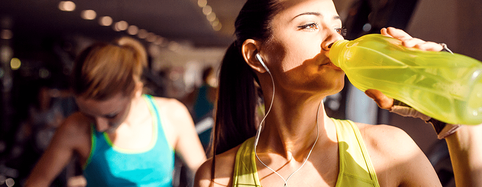 Woman Hydrating After Sweating at the Gym