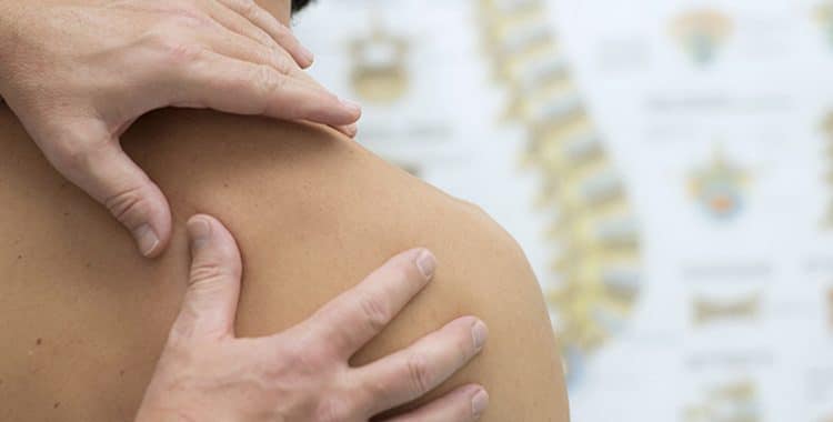 Man Meeting with Chiropractor for Alternative Pain Relief