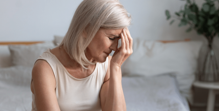 Older Woman Suffering from Menopause Symptoms