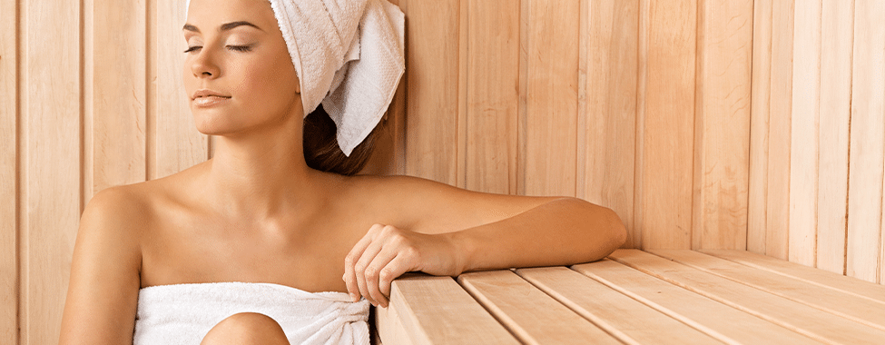 Woman using a sauna for self improvement