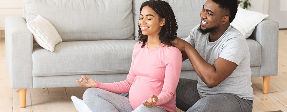 Pregnant couple doing alternative complementary therapies