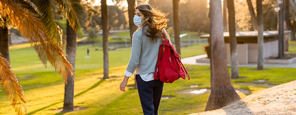 Person wearing a mask for common cold prevention