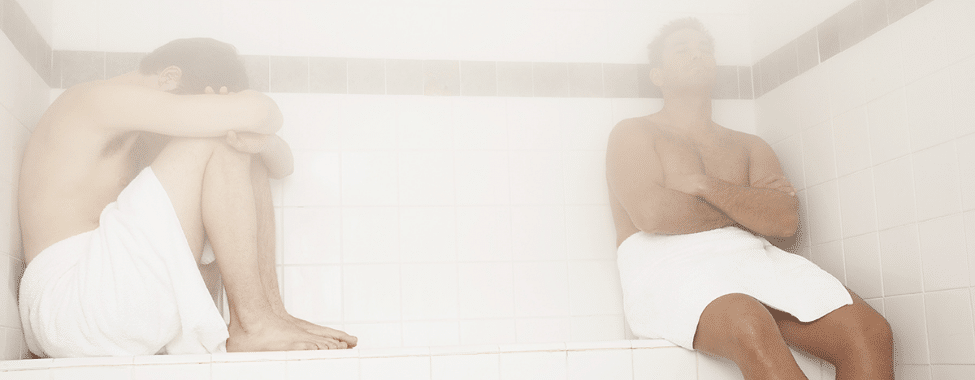 Men Sitting in Steam Room for Health Benefits