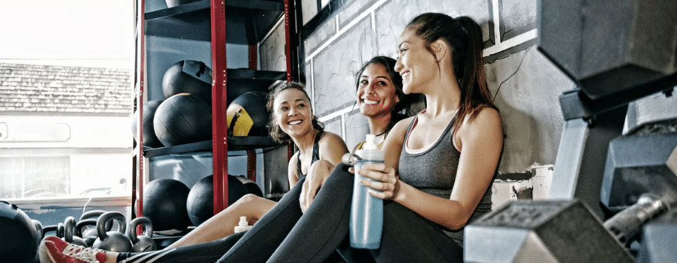 Sweating Friends Smiling After Workout